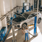 a mechanic performing repair work for BMW car