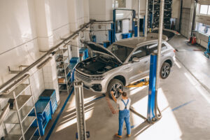 a mechanic performing repair work for BMW car