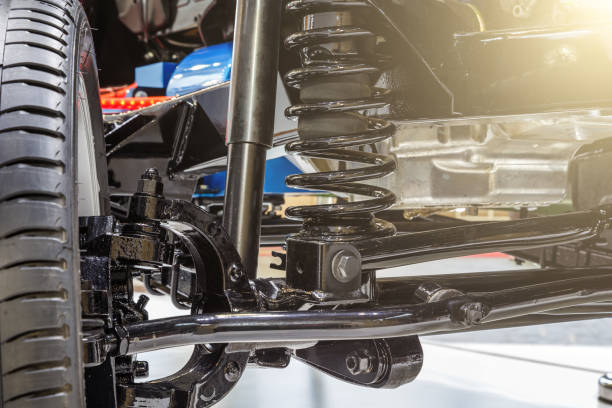 Auto repair technician inspecting vehicle components