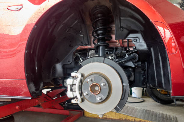 Expert mechanic performing vehicle diagnostics